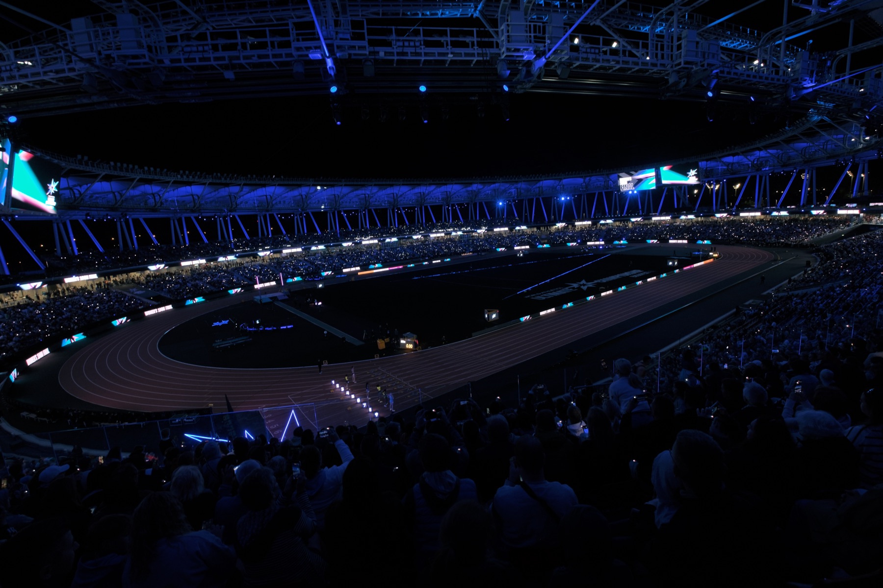 Stadium light show around the track at night